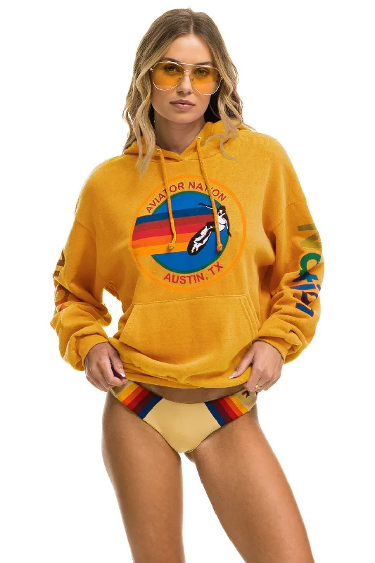 Women's graphic - printed sweatshirt featuring floral patterns for a feminine touchAVIATOR NATION AUSTIN RELAXED PULLOVER HOODIE - GOLD Women's graphic - printed sweatshirt featuring floral patterns for a feminine touchAVIATOR NATION AUSTIN RELAXED PULLOVER HOODIE - GOLD