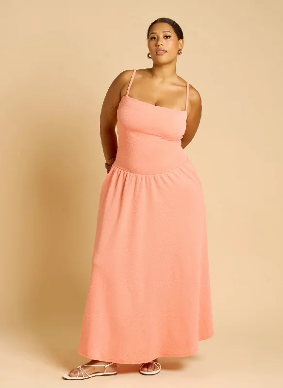 Maxi dresses with an empire waist for a flattering fit on all body typesTeuila Pleated Skater Midi Dress - Coral Maxi dresses with an empire waist for a flattering fit on all body typesTeuila Pleated Skater Midi Dress - Coral