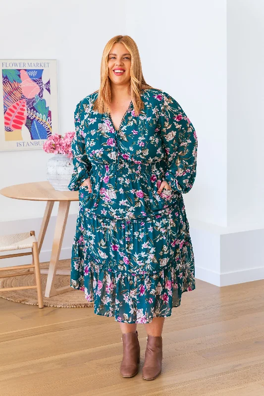 Midi dresses with geometric cutouts for a contemporary and edgy lookYasmin Teal Floral Midi Dress Midi dresses with geometric cutouts for a contemporary and edgy lookYasmin Teal Floral Midi Dress